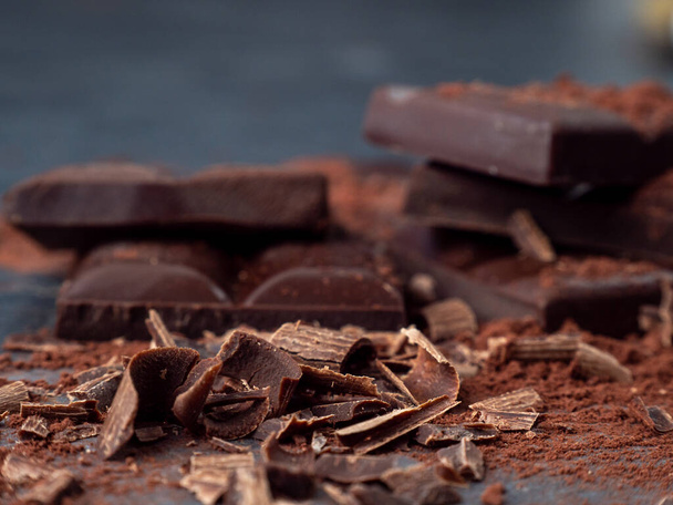 Dark chocolate on a dark background. - Valokuva, kuva