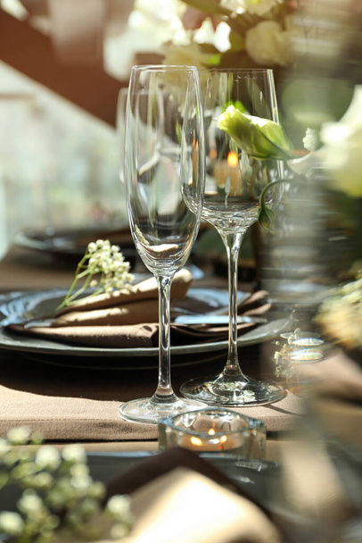 Festive table setting with beautiful tableware and floral decor - Фото, зображення