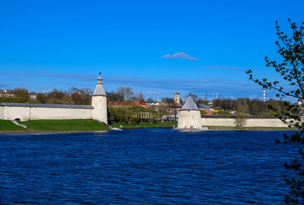 Flat and High towers. Historic site in Pskov. Fortress wall. Pskov Krom. sunny day. - 写真・画像