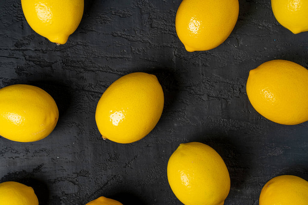 Top view of ripe lemon on black background - Fotografie, Obrázek