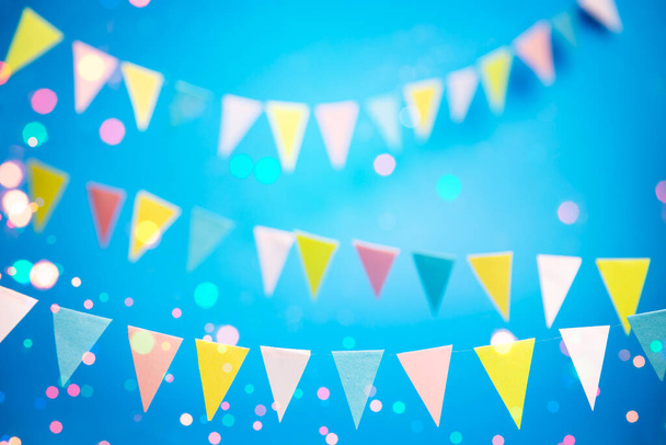 Colorful party flags over blue background - Zdjęcie, obraz