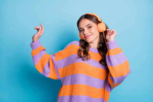 Photo of attractive happy cheerful woman wear headphones music lover isolated on blue color background - Фото, зображення