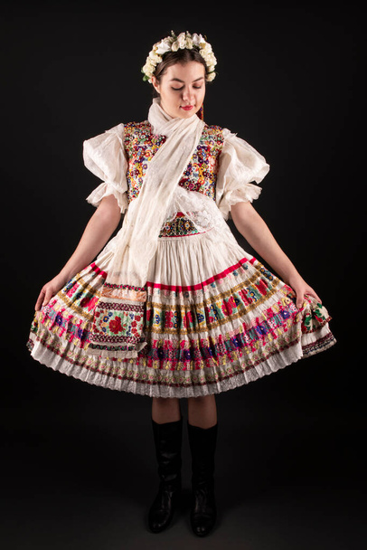 Young beautiful slovak woman in traditional dress. Slovak folklore - Foto, Imagem