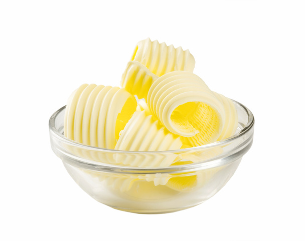 Boucles de beurre dans un bol en verre
 - Photo, image