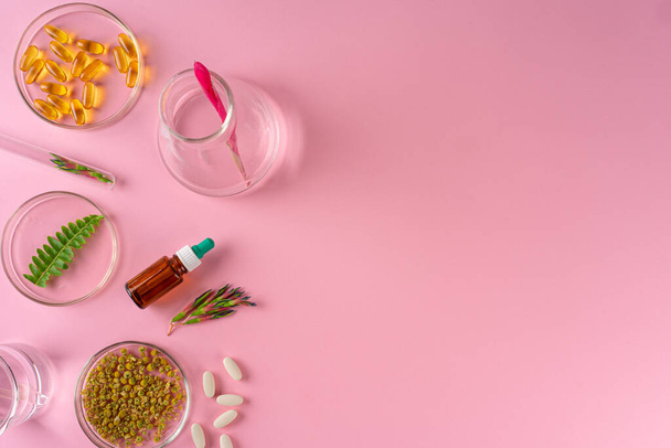Herbs and Herbal dietary supplements top view on pink background - Fotó, kép