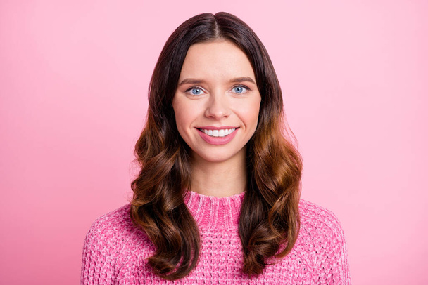 Close-up portrait of attractive content cheerful wavy-haired girl isolated over pink pastel color background - Фото, зображення