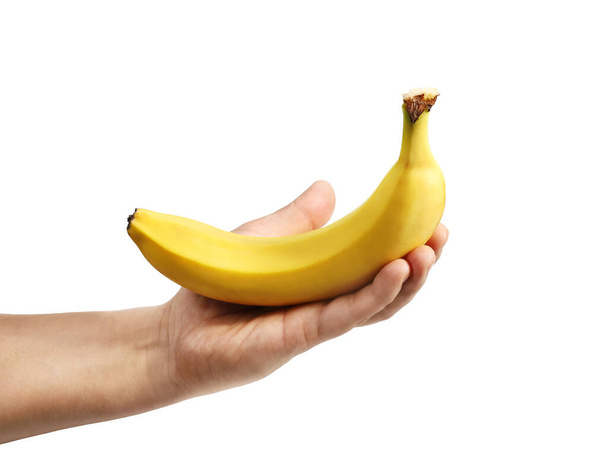 Plátano amarillo en mano aislado en primer plano blanco - Foto, Imagen