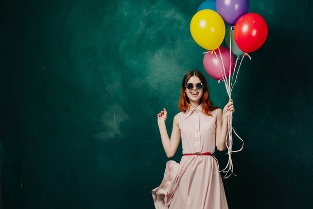 cheerful woman with colorful balloons holiday fun - Foto, Imagen