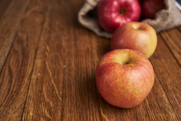 apples on a wooden table vitamins fresh fruits organic - Фото, изображение