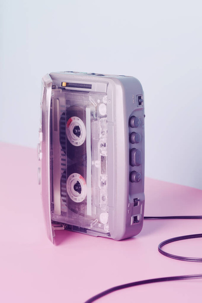 Old audio player with cassette on neon color. retro style. vintage music concept - Foto, imagen