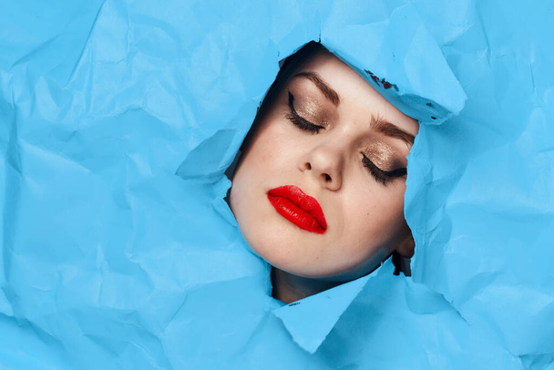 female face blue background red lips makeup emotions - Φωτογραφία, εικόνα