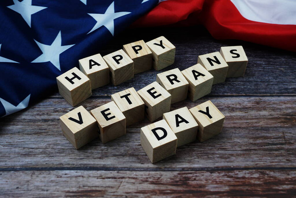 Happy Veterans Day Word alphabet letters with USA flag on wooden background - Φωτογραφία, εικόνα