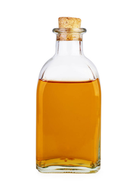 Glass bottle with apple vinegar isolated on the white background - Foto, afbeelding