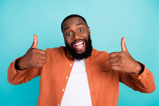 Photo of young black man happy positive smile show thumbs-up like fine feedback ads isolated over teal color background - Foto, Imagem