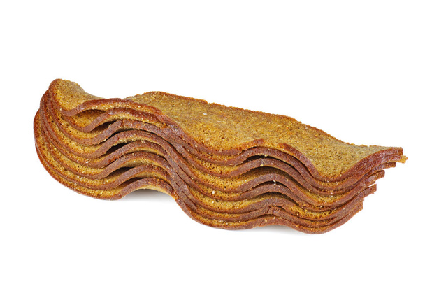 Stack of roasted rye bread rusks isolated on white background - Photo, Image