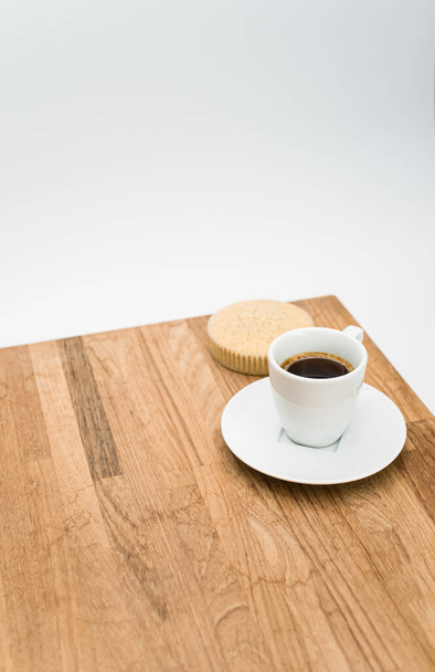 espresso coffee and buckwheat flour organic cake on a wooden and white background with copy space - Fotó, kép