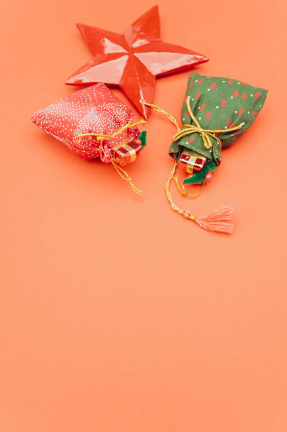 Christmas time decorations with sapce for text on an orange paper surface - Fotografie, Obrázek