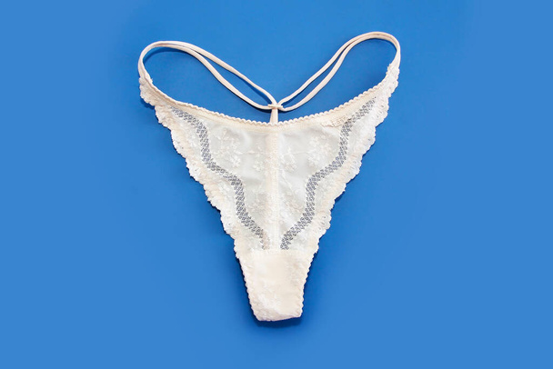 white womens lace panties on blue background - Photo, Image