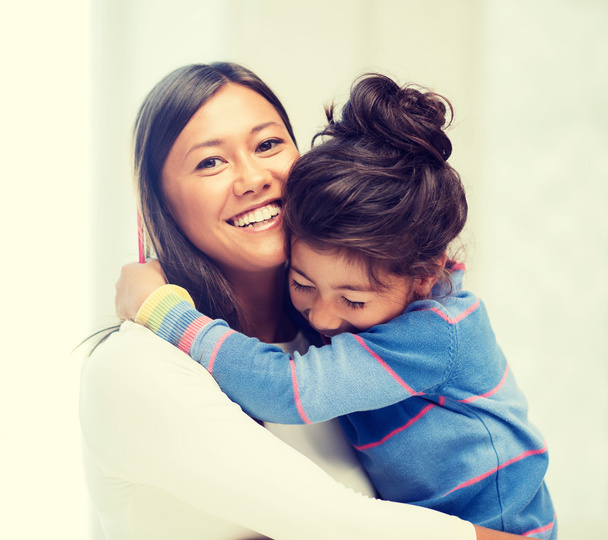hugging mother and daughter - 写真・画像