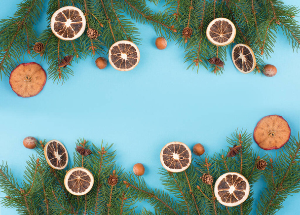 Christmas background with branches of fir, empty copy space, blue backdrop - Zdjęcie, obraz