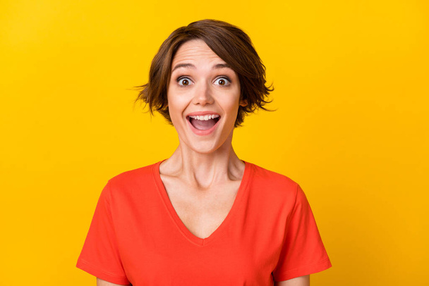 Portrait of nice brunette optimistic lady wear red t-shirt isolated on vivid yellow color background - Φωτογραφία, εικόνα
