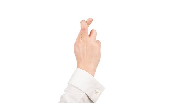 схрещені пальці жест зробити бажання чоловічою рукою ізольовані на білому, фальшиві обіцянки
 - Фото, зображення