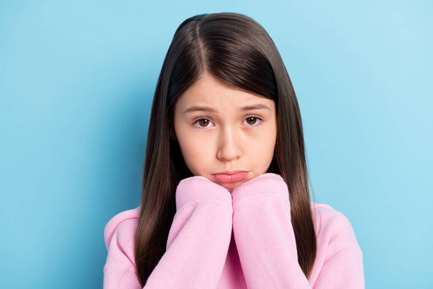 Close-up portrait of attractive sad offended girl feeling tired disappointed isolated over bright blue color background - Foto, Imagem