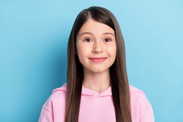 Photo of funny adorable schoolgirl dressed pink outfit smiling isolated blue color background - Φωτογραφία, εικόνα