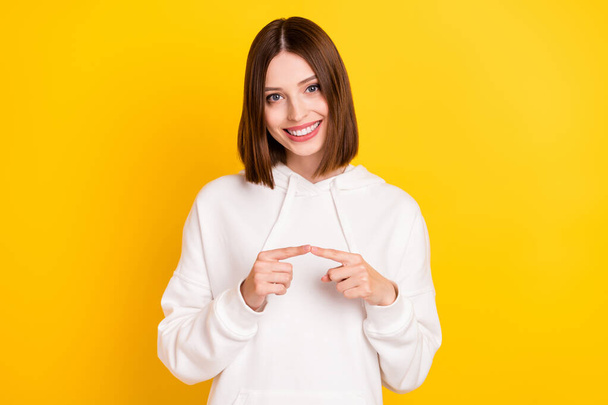 Portrait of attractive cheerful shy girl coquettish mood isolated over bright yellow color background - Фото, зображення