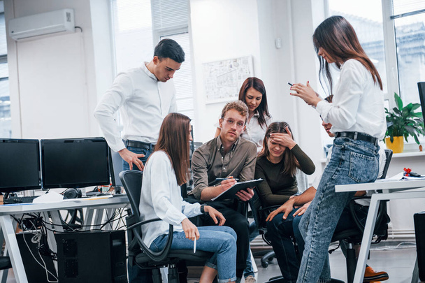 Group of young business people that standing and sitting and working in the office. - 写真・画像