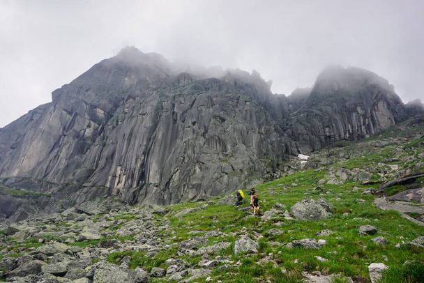 Natural Park Ergaki, Russia - July 15, 2019: Tourist group climbs the mountains - Photo, image