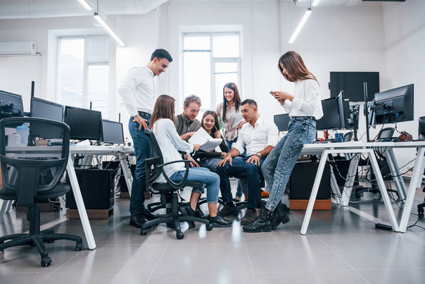 Group of young business people that standing and sitting and working in the office. - Фото, изображение