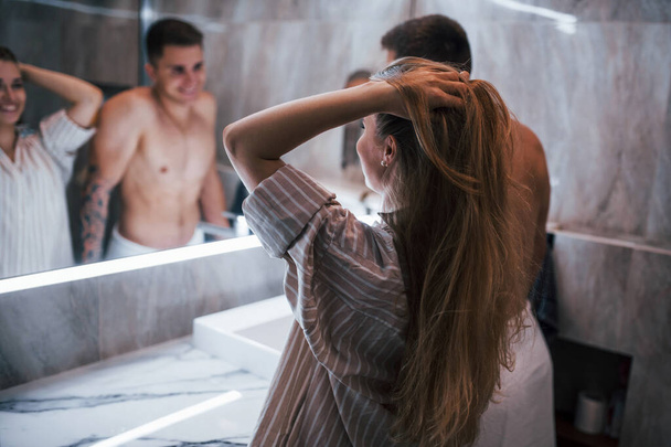 Young couple together in the bathroom at morning time. - Fotografie, Obrázek