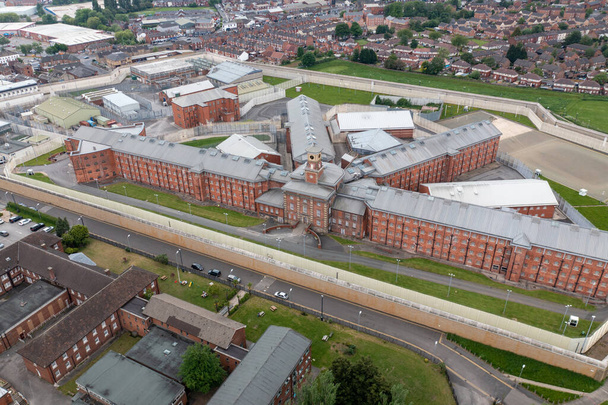Aerial drone footage of the town centre of Wakefield in West Yorkshire in the UK showing the main building and walls of Her Majesty's Prison - Photo, Image