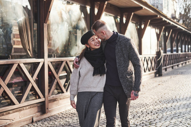 Lovely multiracial couple have a walk in the city and embracing each other. - Foto, afbeelding