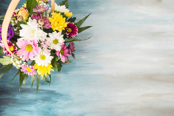 flower bouquet wicker basket placed table. High quality photo - Фото, зображення