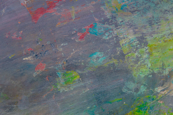 fond bigarré créatif coloré : résidus tachés de peintures à l'huile sur une palette en bois, mise au point courte, flou sélectif - Photo, image