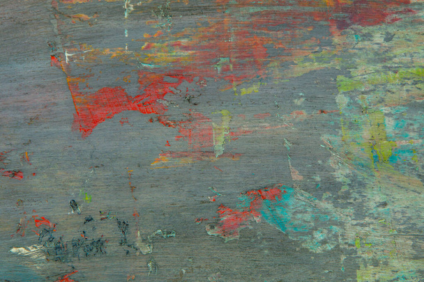 красочный творческий пестрый фон: размытые остатки масляных красок на деревянной палитре, короткая фокусировка, выборочное размытие - Фото, изображение
