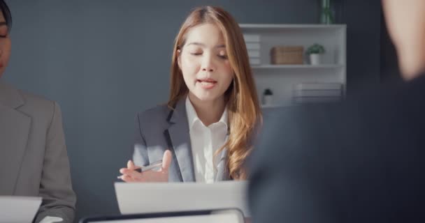 Happy young Asia businessmen and businesswomen meeting brainstorming some new ideas about project to his partner working together planning success strategy enjoy teamwork in small modern home office. - Кадры, видео