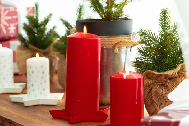 Interior decoration with red and white Christmas candles - Fotografie, Obrázek
