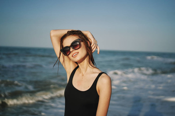 cheerful woman in black swimsuit sunglasses ocean travel - Foto, Imagem