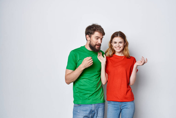 married couple hug friendship colorful t-shirts family studio lifestyle - Photo, Image