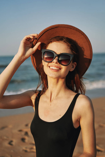 cheerful woman in sunglasses Sandy coast landscape sun - Φωτογραφία, εικόνα