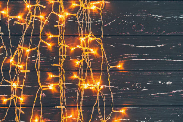 Christmas garland on wooden background with copy space - Φωτογραφία, εικόνα