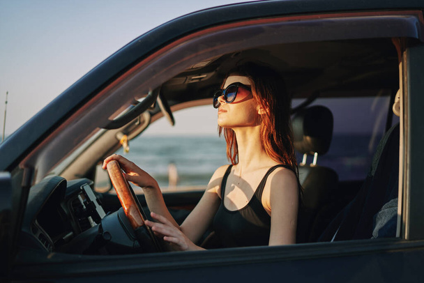 cheerful woman in sunglasses driving a car trip travel - Photo, image