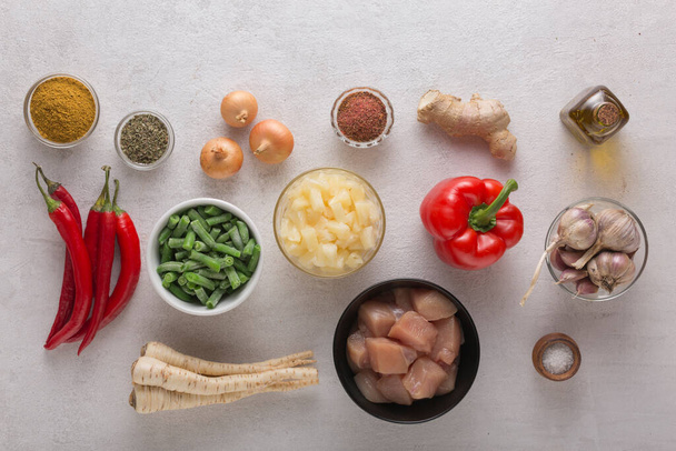 vegetables and meat in assortment for cooking oriental dishes on a light background, top view - 写真・画像