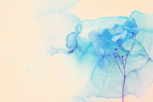 Creative image of blue Hydrangea flowers on artistic ink background. Top view with copy space - Photo, image
