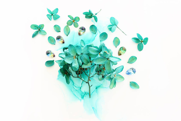 Creative image of emerald and green Hydrangea flowers on artistic ink background. Top view with copy space - Valokuva, kuva