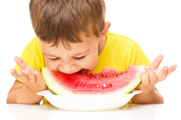 Little boy is eating watermelon - Fotoğraf, Görsel