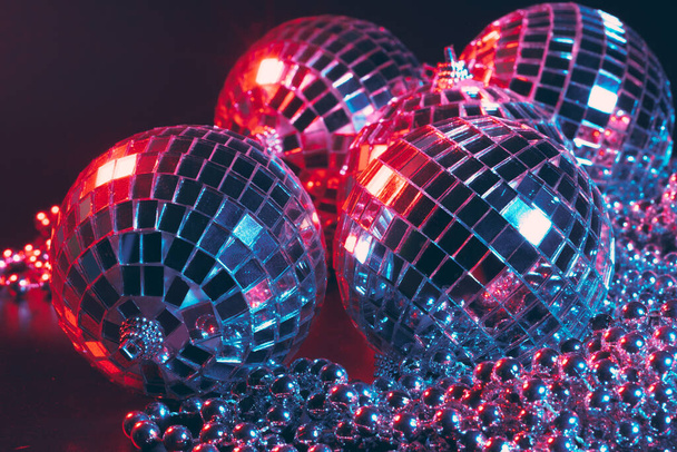 Shiny disco party background with mirror balls reflecting light - Φωτογραφία, εικόνα